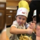 a photo of a girl wearing a chef hat